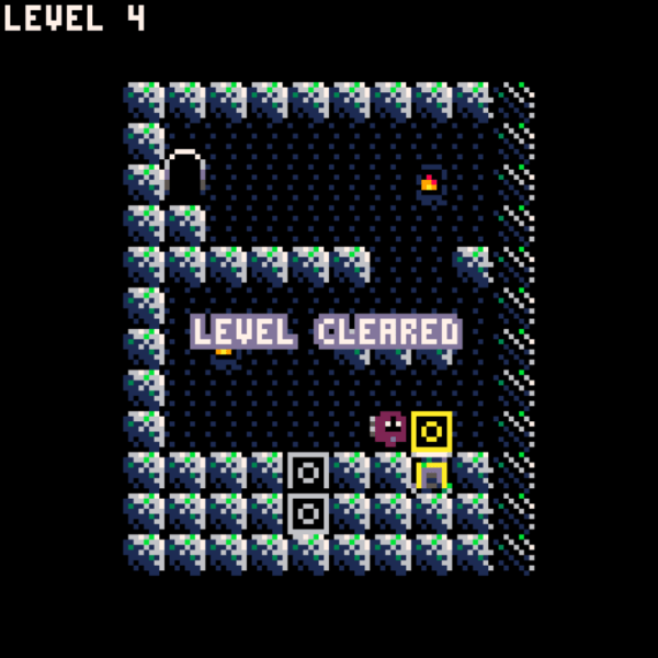 The player pushing the yellow block onto the pedestal, and the screen dissolving with 'LEVEL CLEARED'