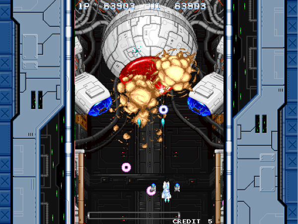 Player destroying a huge orb-shaped boss at the top of the screen in vertical shooter Battle Crust
