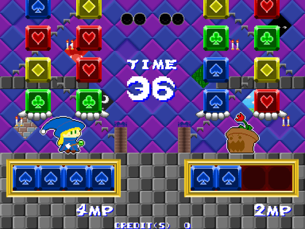 A witch facing off against a potted flower monster in Nitacle Witch, with two columns of blocks resting on a pair of outstretched hands, and a row of blue cubes lined up underneath.